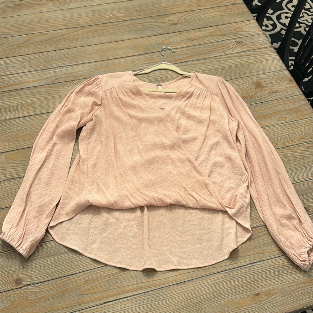 Free people blouse size medium light pink cross front and high low hem